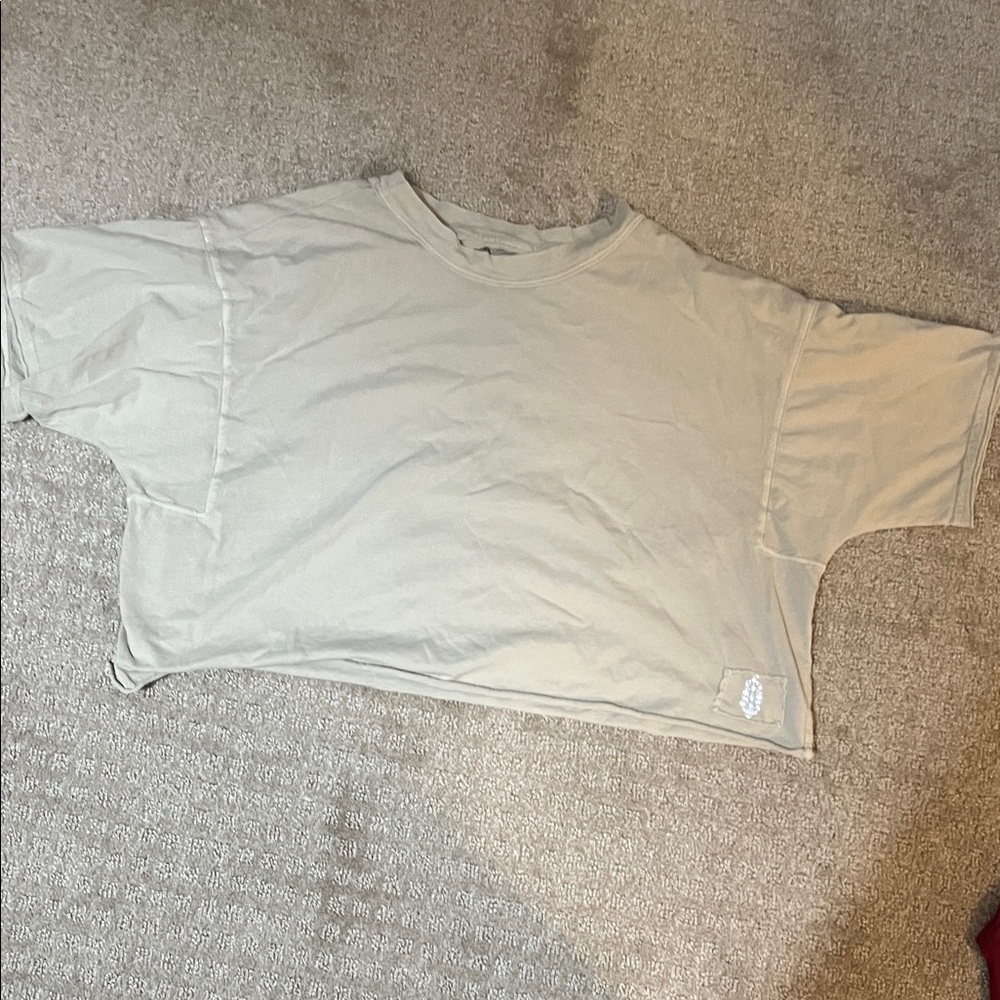 Beige free people movement inspire me tee